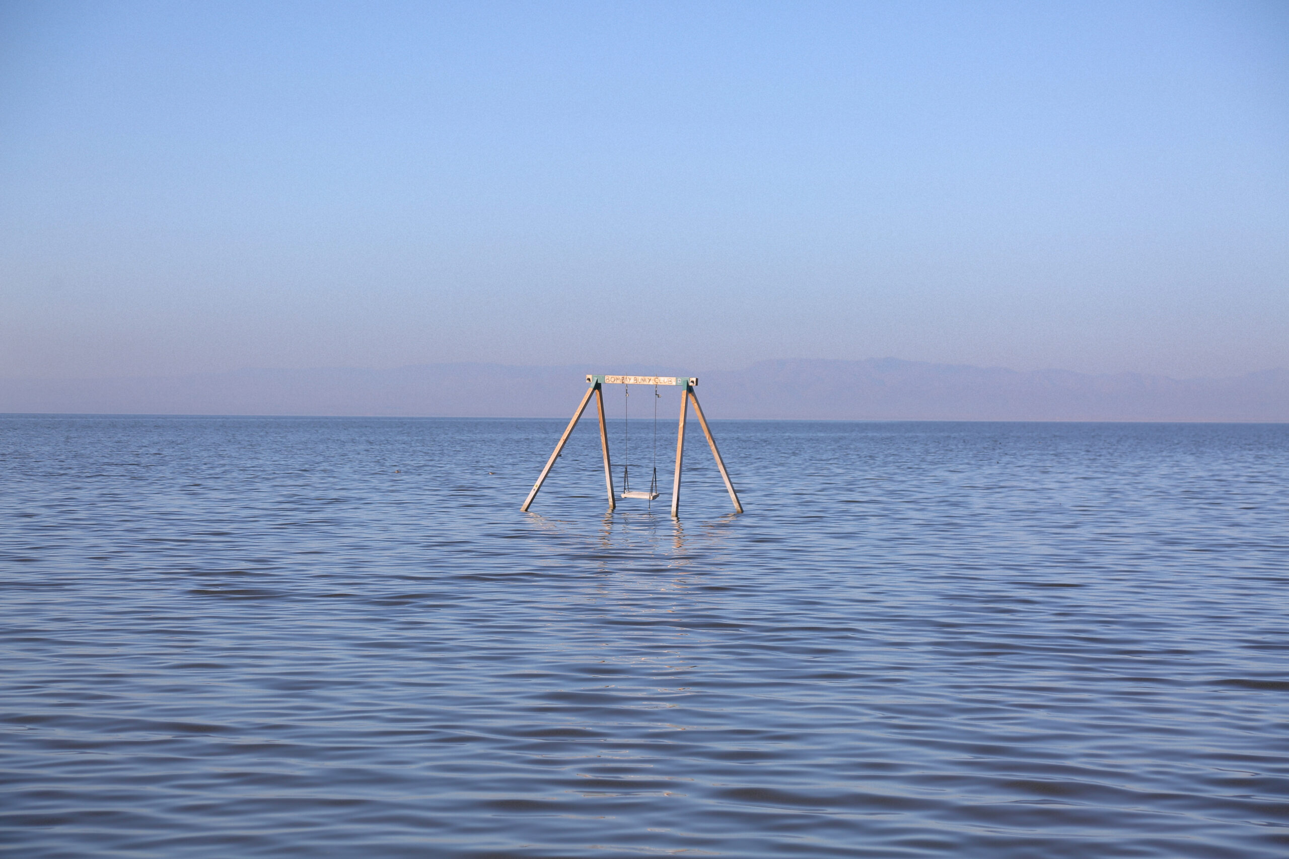 A swing set out in the water at Salton Sea in Southern California.