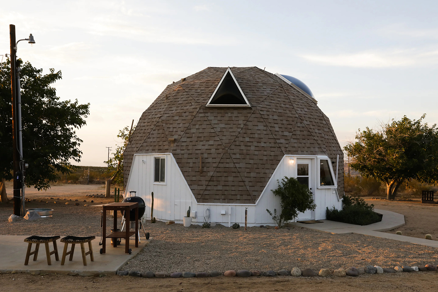 Exterior view of a geodesic vacation rental called Abracadabra Dome near Joshua Tree National Park, California.