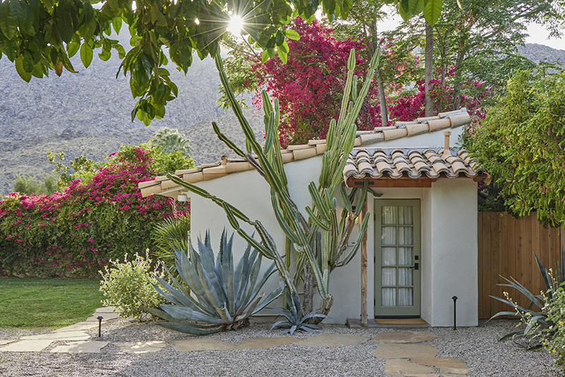 Cacti and agave against a villa at Casa Cody in Palm Springs, California