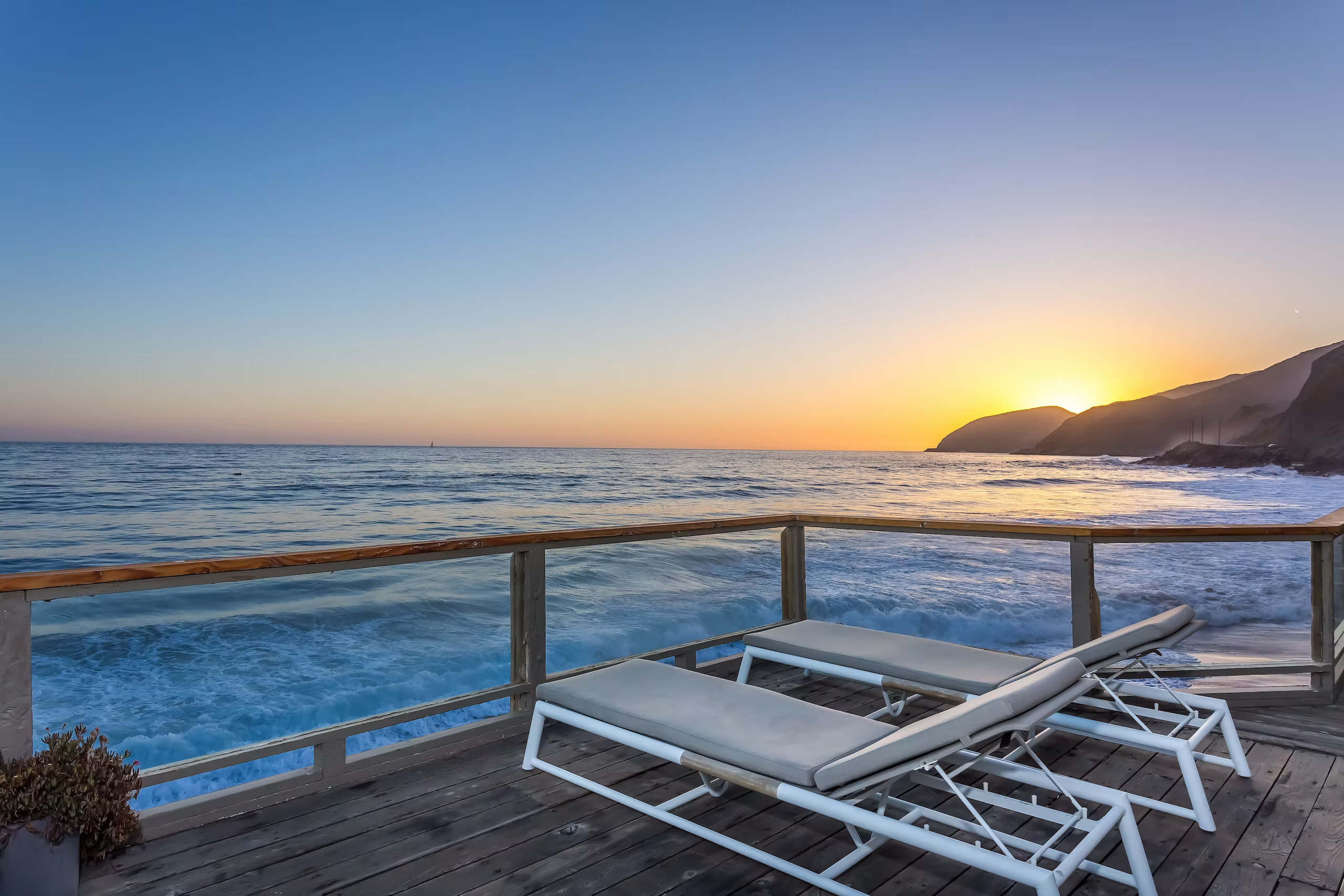 Sunset over the Pacific Ocean from the patio at Malibu California vacation rental home called Point Break.