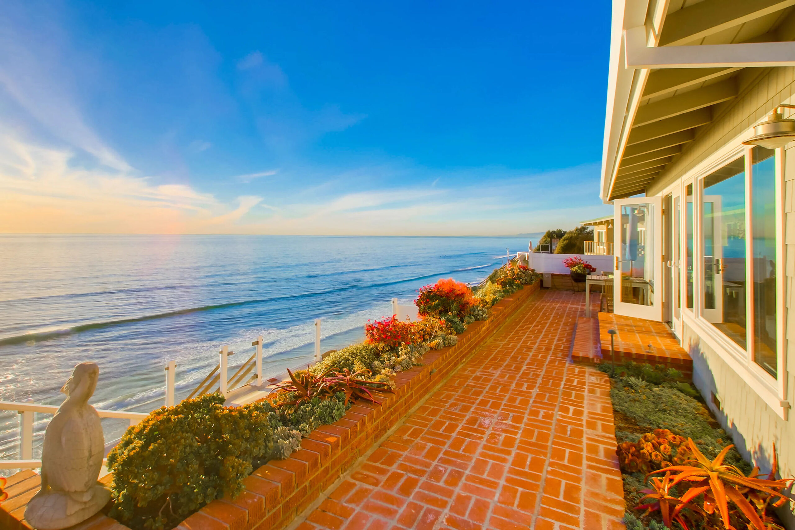 A large brick deck overlooking the Pacific Ocean in Southern California.