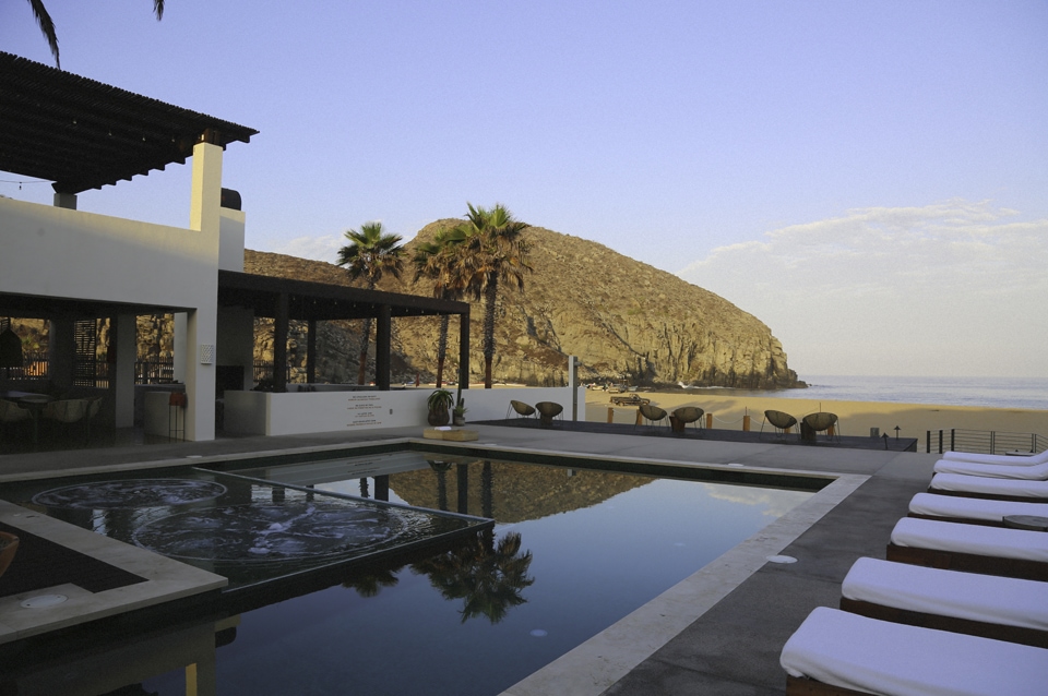 The pool with steps leading to the beach and ocean at Hotel San Cristóbal in Todos Santos, Baja California Sur, Mexico.