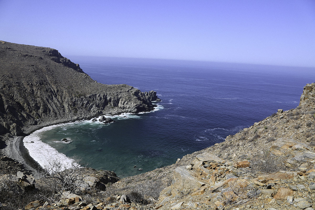 Looking down from a rocky cliff to Secret Beach in the Pacific Ocean near Todos Santos, Baja California, Mexico.