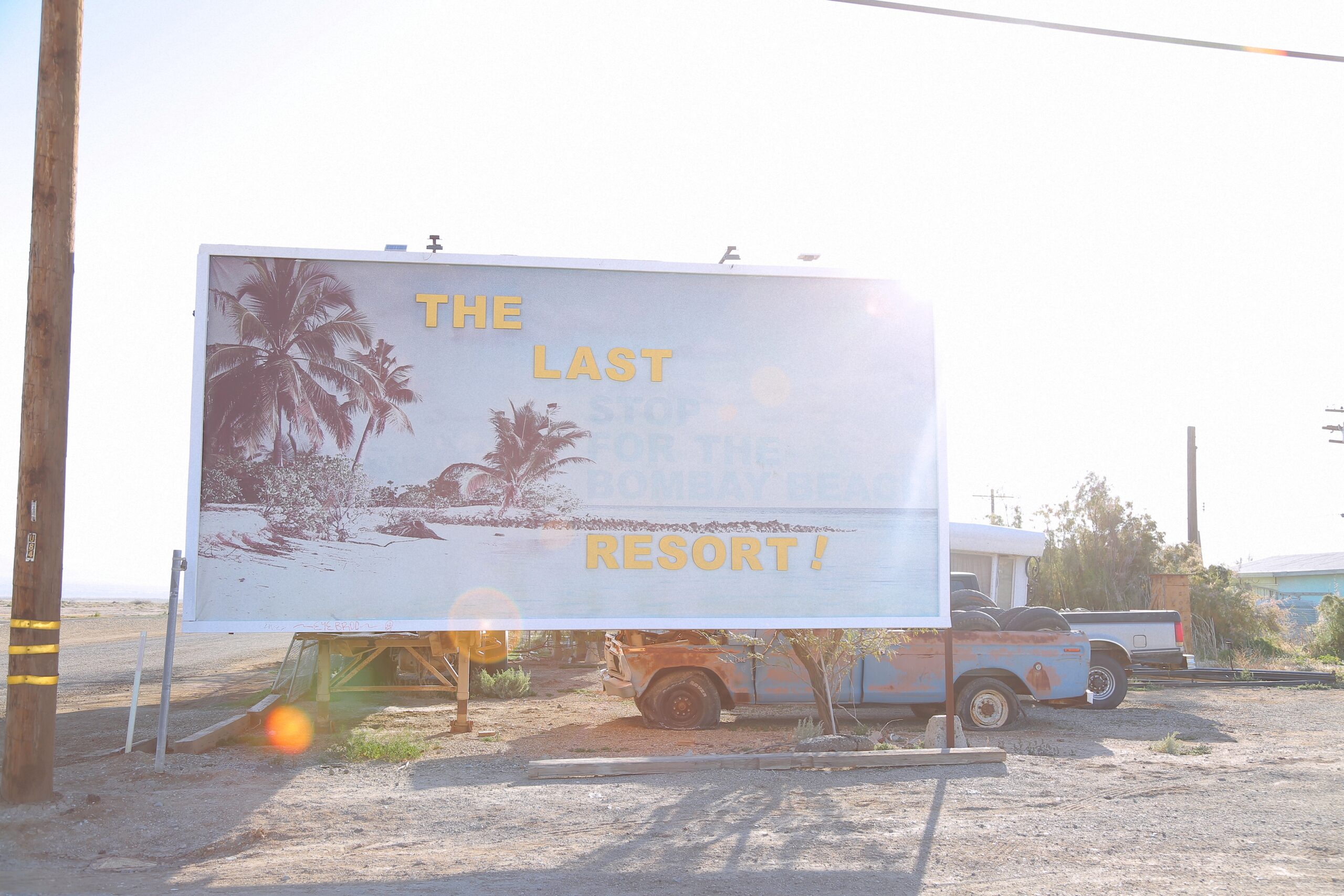 A billboard that reads 'The Last Resort!' near the Salton Sea, California.