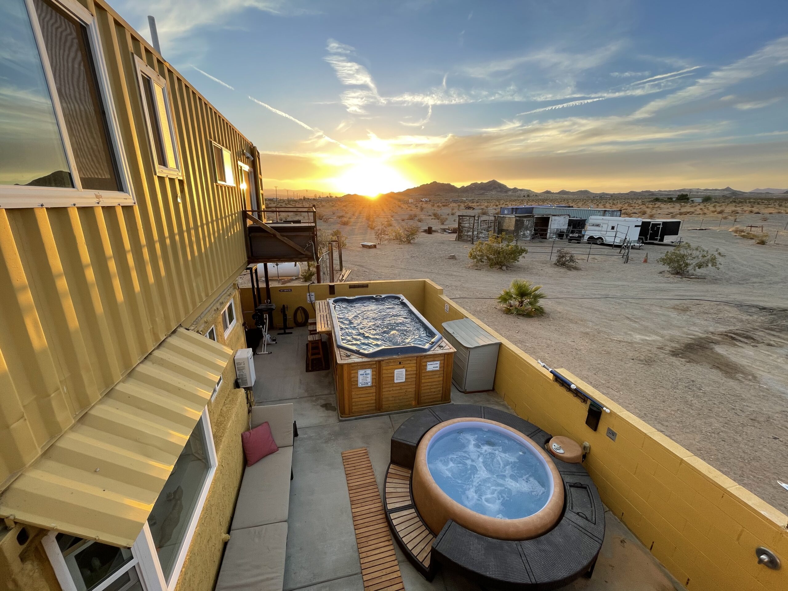 Exterior birds eye view of the pool and hot tub at Twentynine Palms vacation rental home called Desert Skybox Retreat.