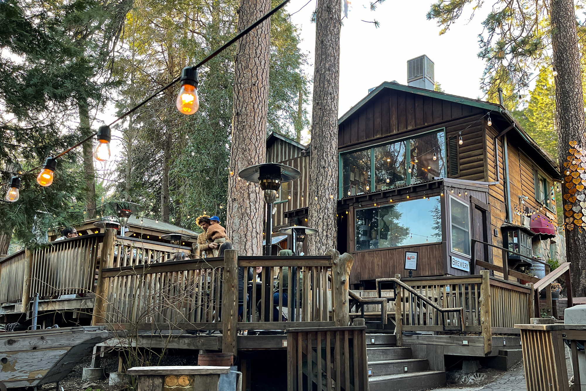 Exterior view of the alpine style building and deck of Lou Eddie's dining establishment in Lake Arrowhead, California.