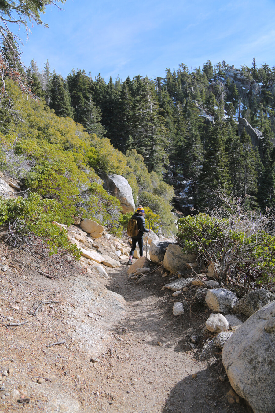 A woman on a hiking trail in Idyllwild, California.