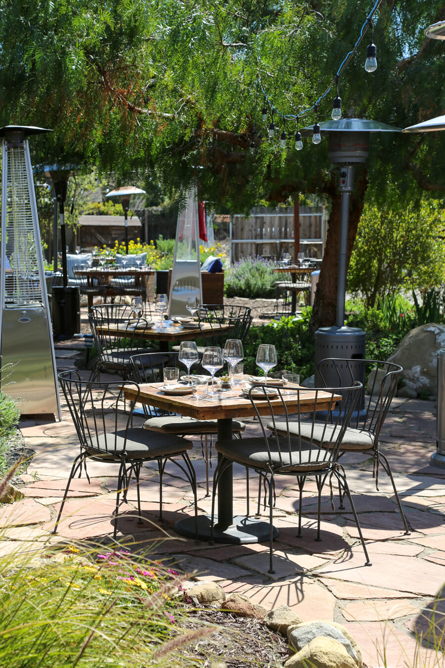 An outdoor patio table set for four at Pico in Los Alamos, California.