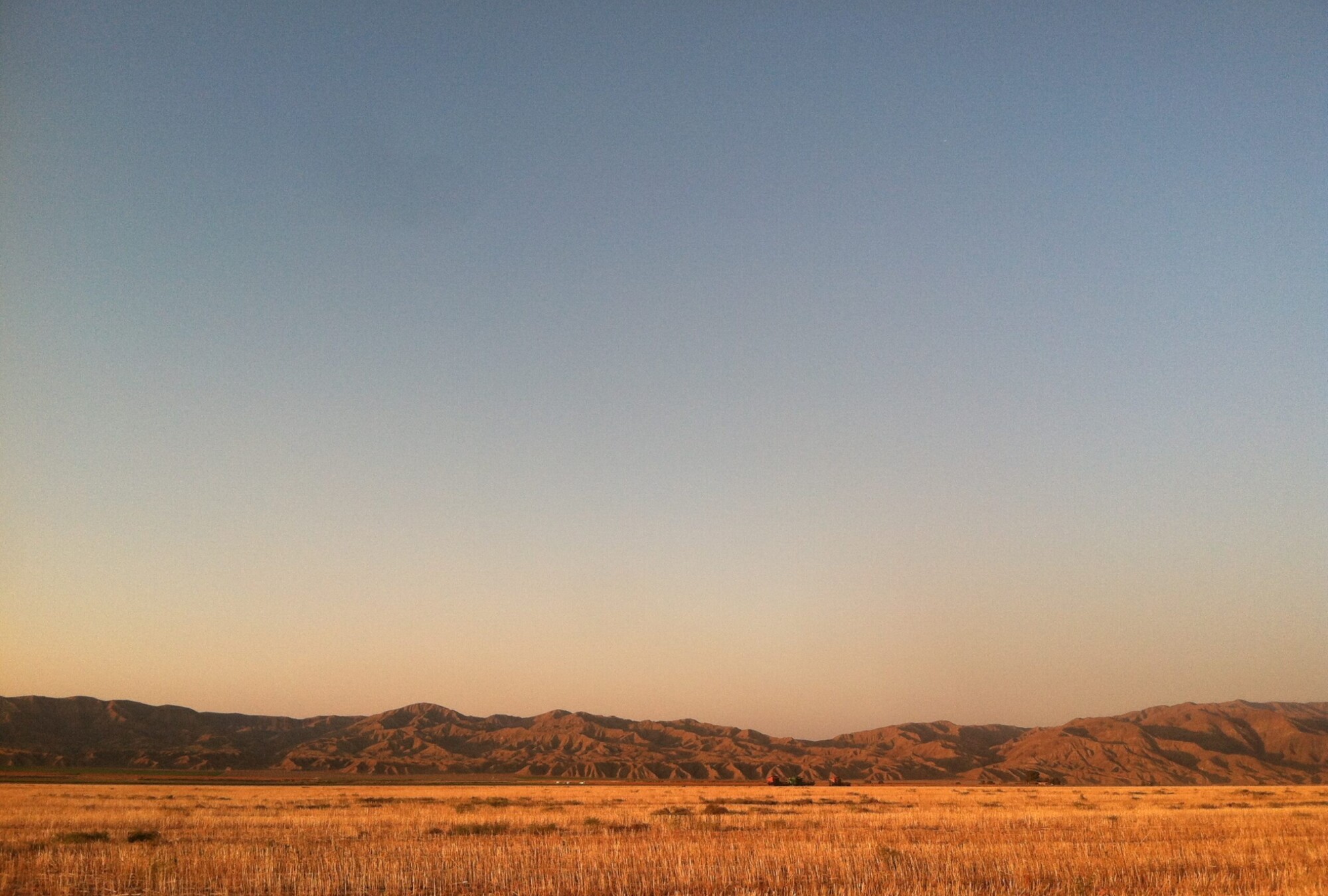 Sunset view of the far away mountains from Blue Sky Center in New Cuyama, California.